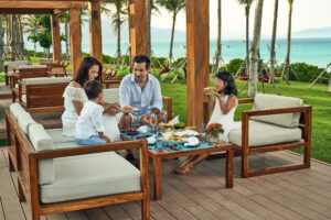 Family enjoys their vacation at Tropicana Beach Club in the beachfront resort Mövenpick Resort Cam Ranh