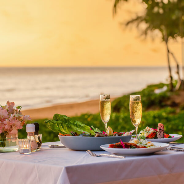Romantic dinner by the beach at Movenpick Resort Cam Ranh's private shore.