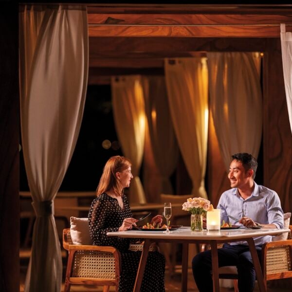 Couple enjoying a honeymoon in Vietnam at a beachfront pool villa, Mövenpick Resort Cam Ranh