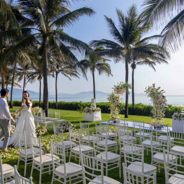 Tropical garden beach wedding venue with ocean view at Mövenpick Resort Cam Ranh, Vietnam