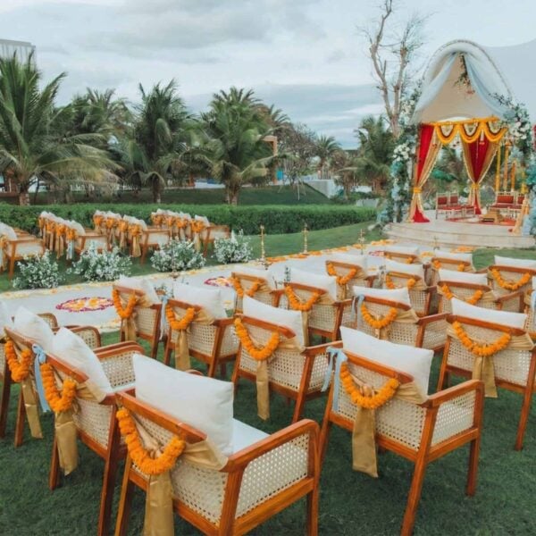Outdoor Indian wedding mandap with marigold decor for the vows ceremony at Mövenpick Resort Cam Ranh, Vietnam